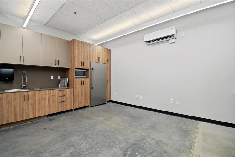 Greyloch Commercial Breakroom Cabinetry commercial breakroom with wood cabinets and mini fridge