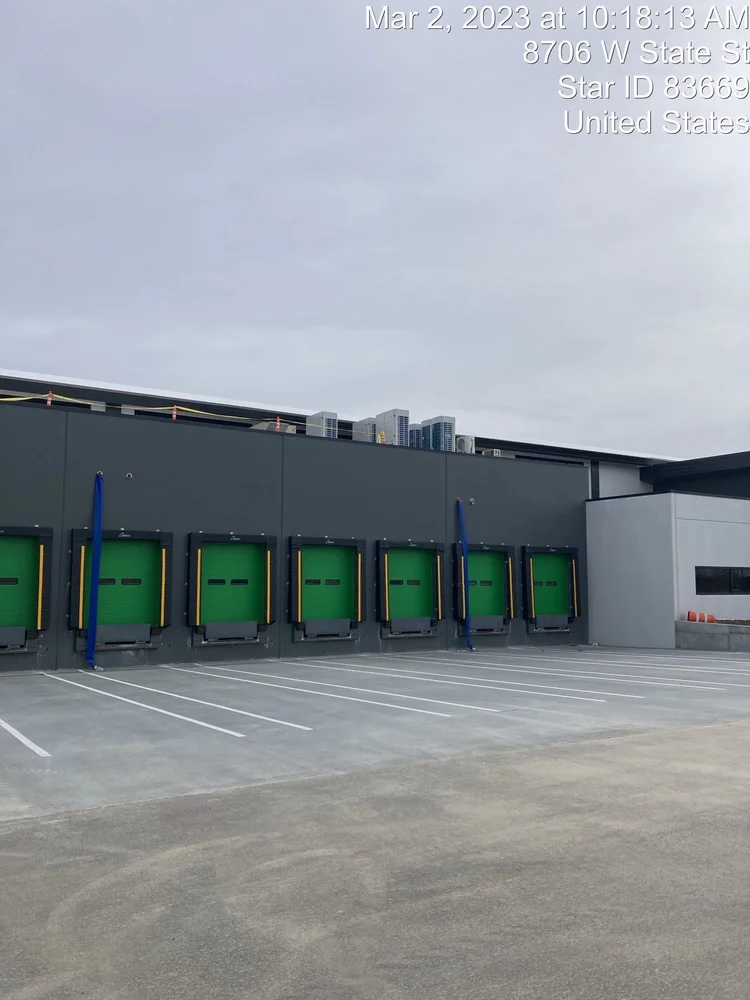 Greyloch Industrial Facility Exterior greyloch building exterior with green roll-up doors