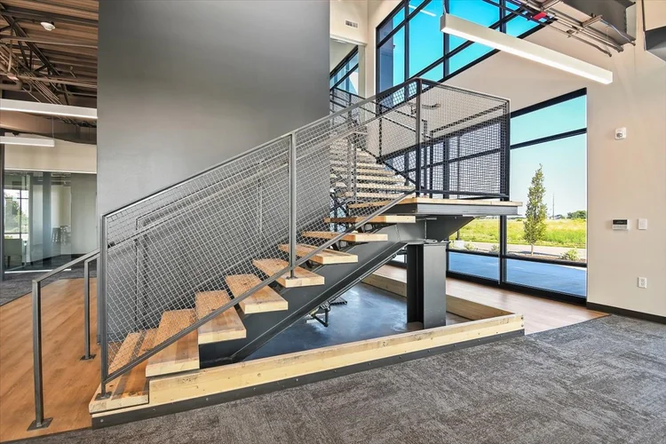 Greyloch Commercial Interior Staircase modern commercial staircase with cable railing and glass windows