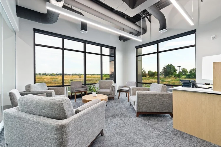 Greyloch Commercial Office Interior modern office lounge with floor-to-ceiling windows