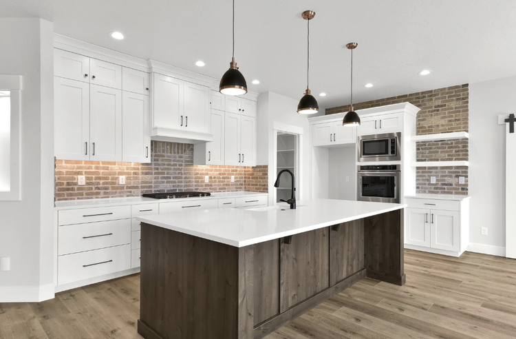 Greyloch Custom Kitchen – White Shaker Cabinets with Brick Backsplash white shaker kitchen cabinets with brick backsplash and dark island