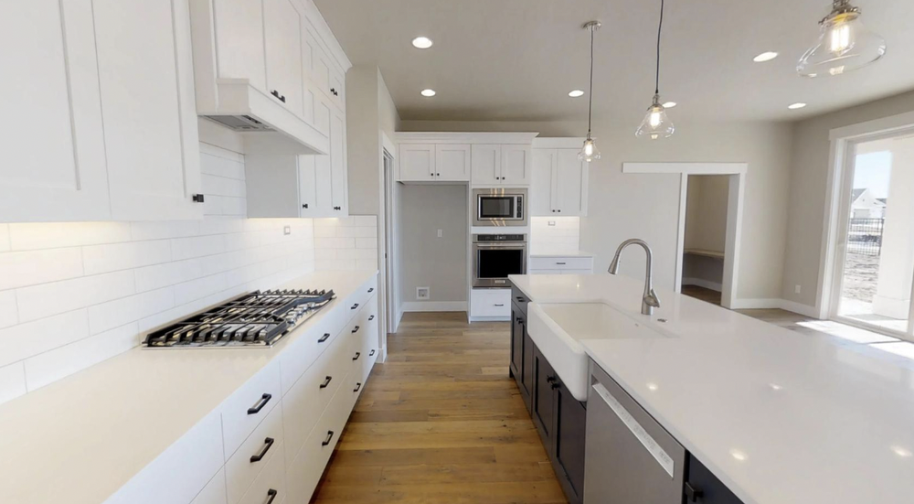 Greyloch White Kitchen Cabinet Installation white kitchen cabinets with quartz countertops and stainless appliances