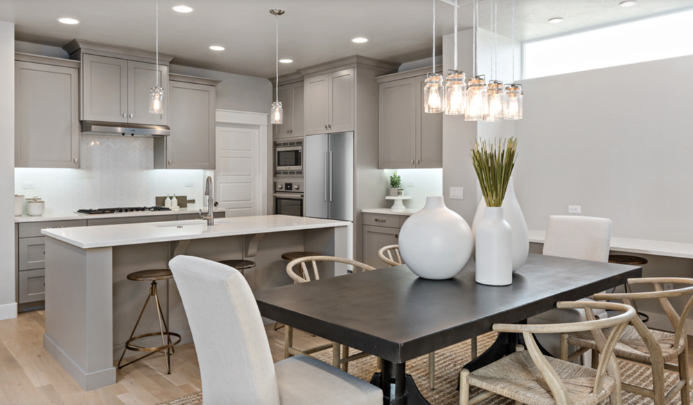 Greyloch Gray Kitchen with Dark Contrast Island gray kitchen cabinets with dark island and pendant lighting