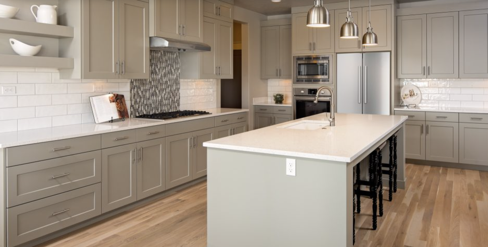 Greyloch Kitchen with Mosaic Tile Backsplash tan kitchen cabinets with mosaic tile backsplash and large island