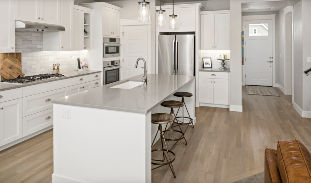Greyloch White Kitchen Island Installation white kitchen island with bar stools and stainless appliances