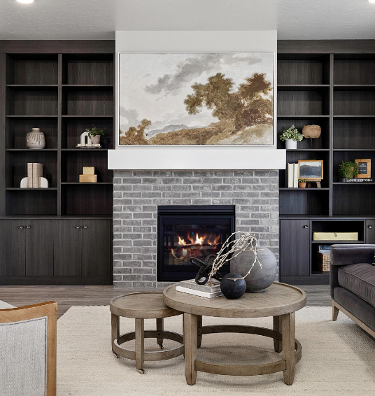 Greyloch Custom Built-In Shelving with Fireplace dark built-in shelving with brick fireplace and artwork display