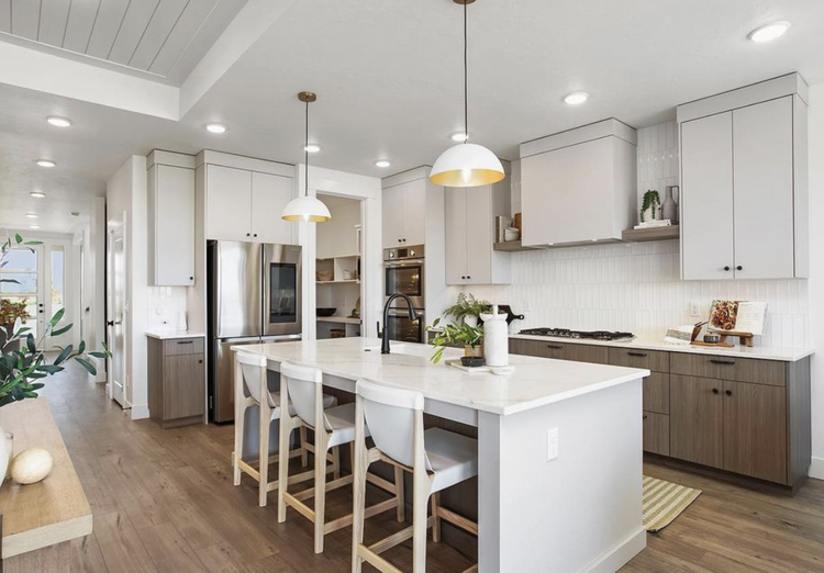 Greyloch White Kitchen with Wood Island white kitchen with wood island and gold pendant lighting