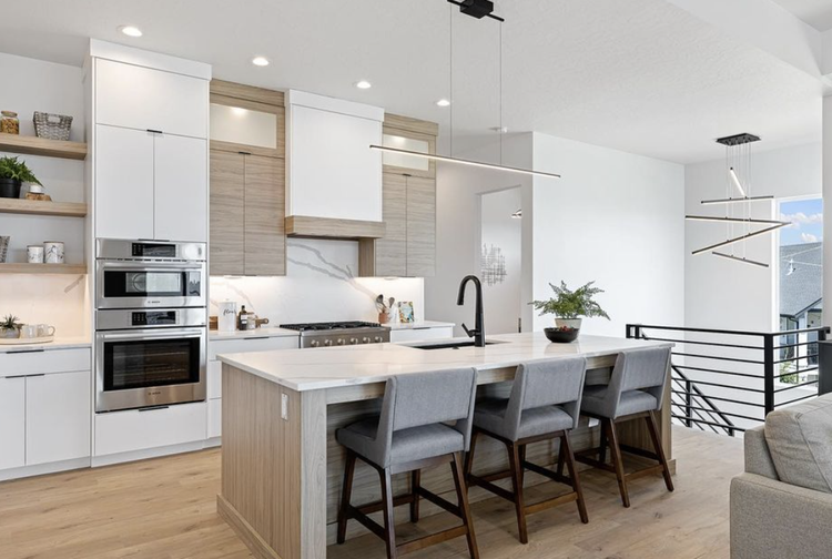 Greyloch Two-Tone White and Wood Kitchen white and wood kitchen with island seating and stainless appliances