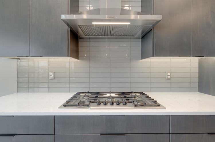 Greyloch Gray Kitchen with Tile Backsplash gray kitchen with tile backsplash and stainless range hood