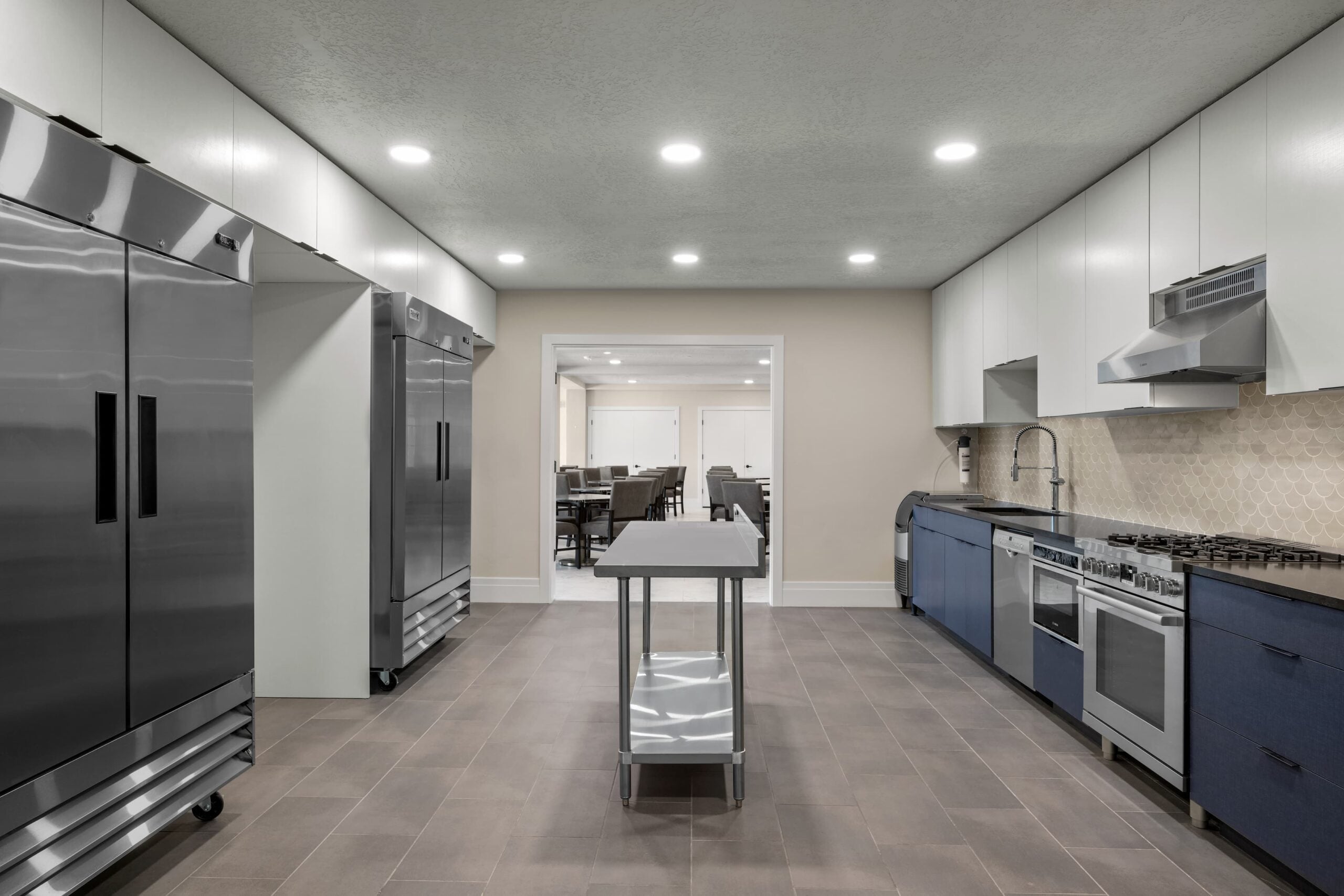 commercial breakroom with wood cabinets and mini fridge